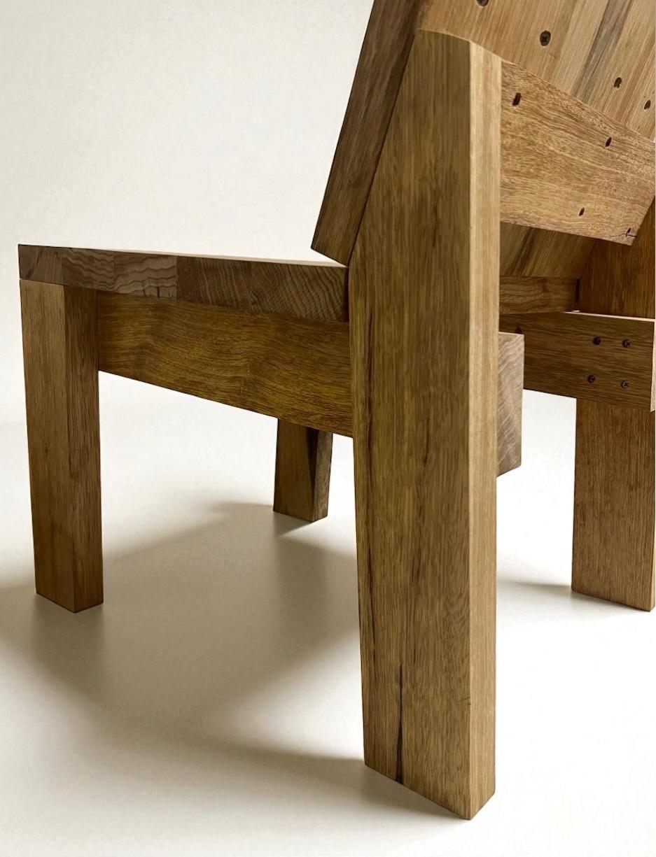 Side view detail of the Limba wood chair showing robust design - 2